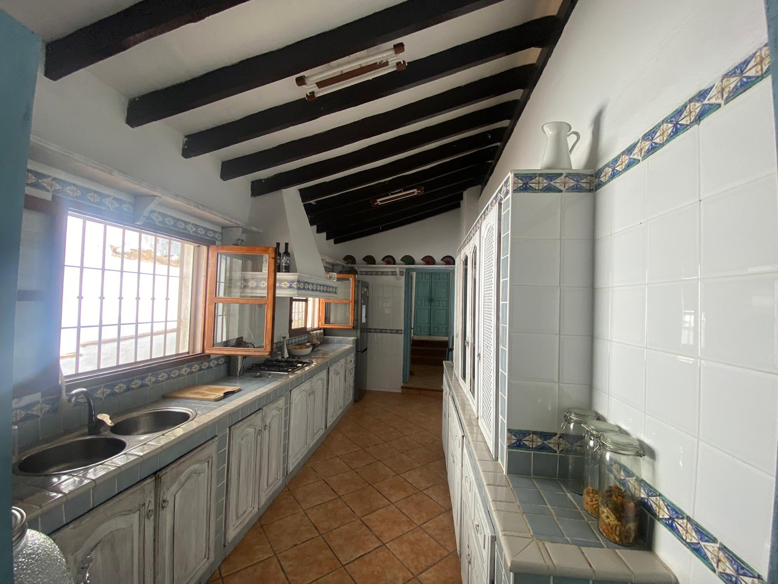 Kitchen with beamed ceiling