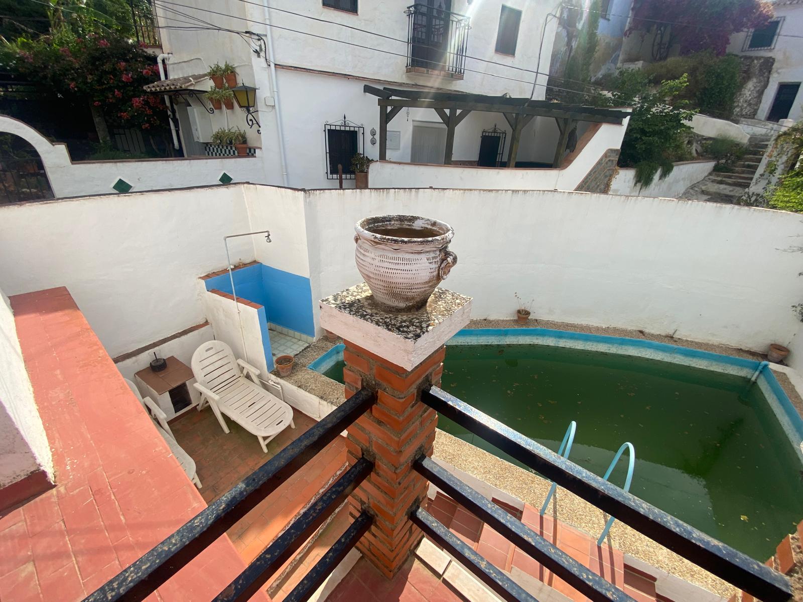 Pool patio with whitewashed walls